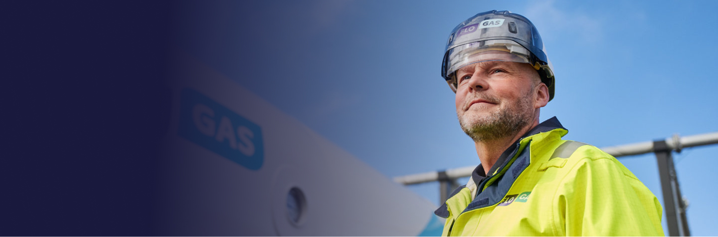 Man wearing safety gear looking forward.